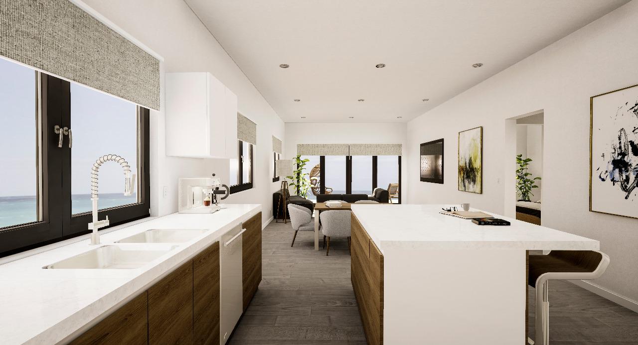 Open designer kitchen and dining area with ocean views
