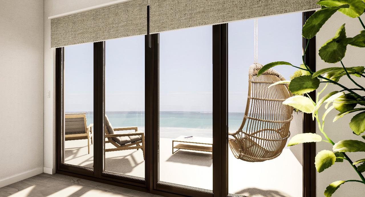 Floor-to-ceiling terrace doors framing the Gulf